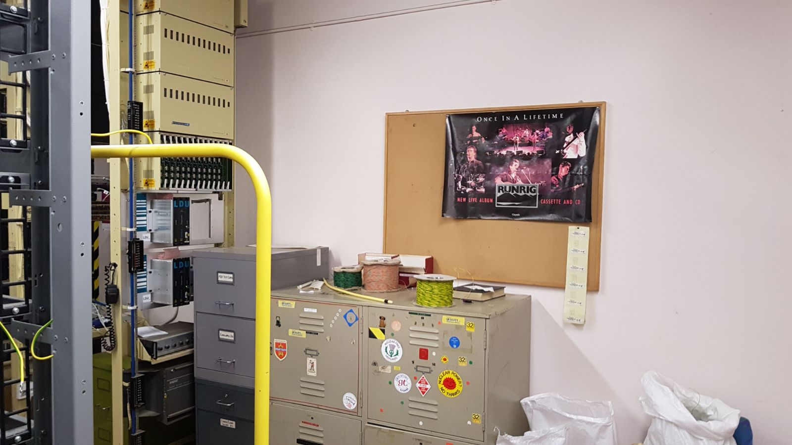 Photo from the inside of a telephone exchange, complete with Runrig poster